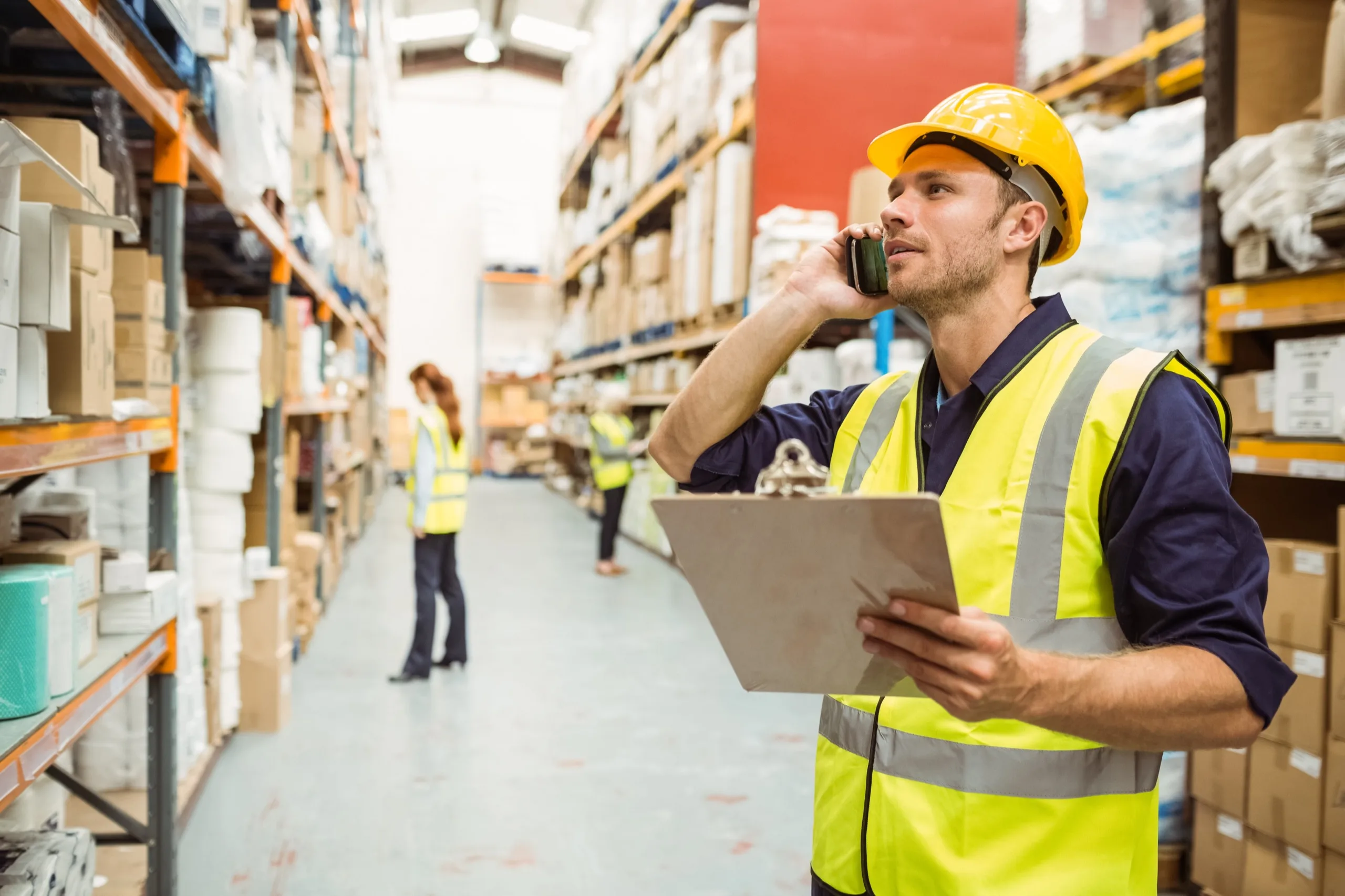 Warehouse coordinator speaking on a phone
