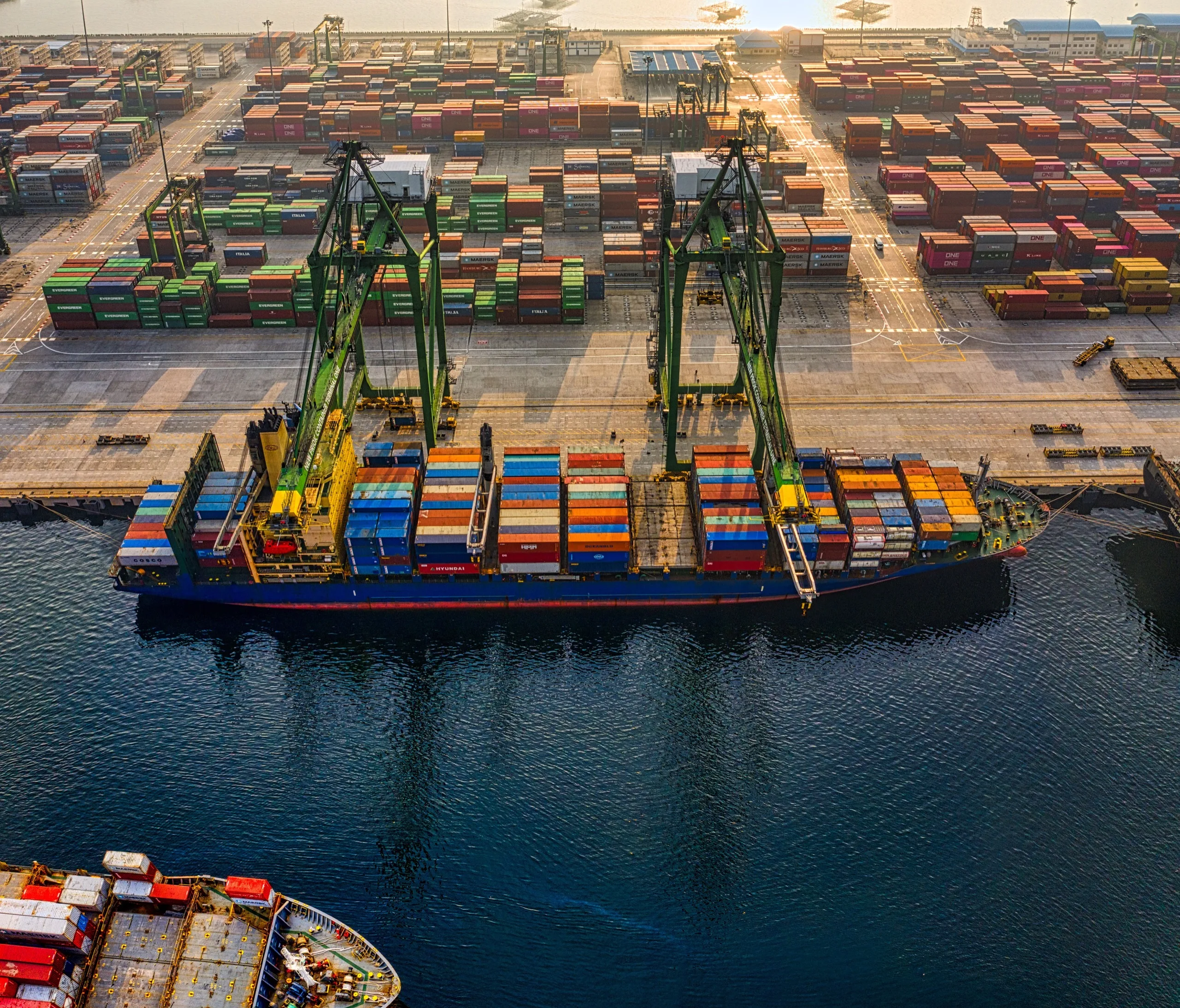 Container ship and port terminal viewed from above
